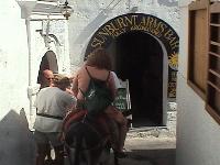Julie and Robert on donkey heading up the acropolis of Lindos