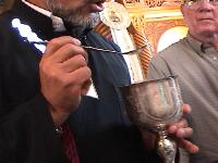 Chalice and demonstration of how communion is administered